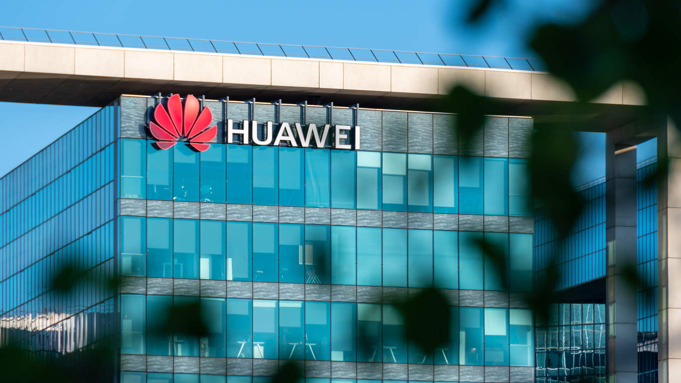 Boulogne-Billancourt, France - June 6, 2020: French headquarters of Huawei Technologies, chinese multinational company which designs, develops, and sells telecommunications equipment and smartphones. Blurred foliage in the foreground